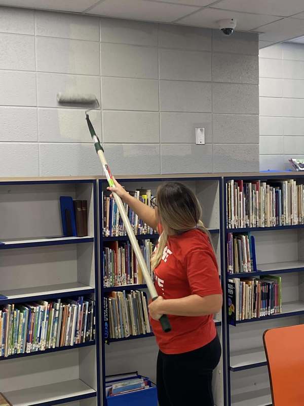 CFSB staff paint JES library