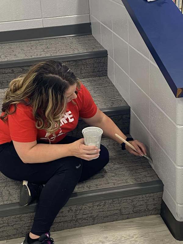 CFSB staff paint JES library