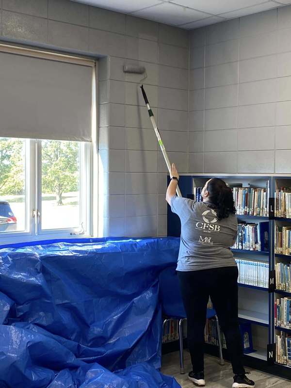 CFSB staff paint JES library