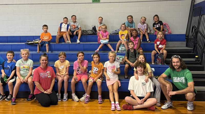SES Run Club posing in gym