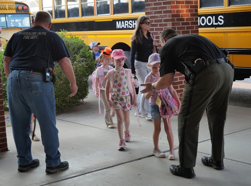 JES students greeted at school with high fives/fist bumps