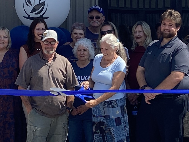 Needline Director Hollie Darnall cutting the ribbon