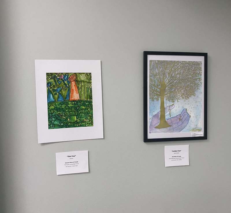 Two pieces of artwork featuring trees