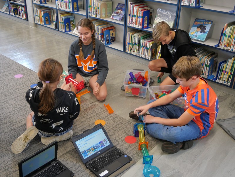 SES student working with Picasso Tiles