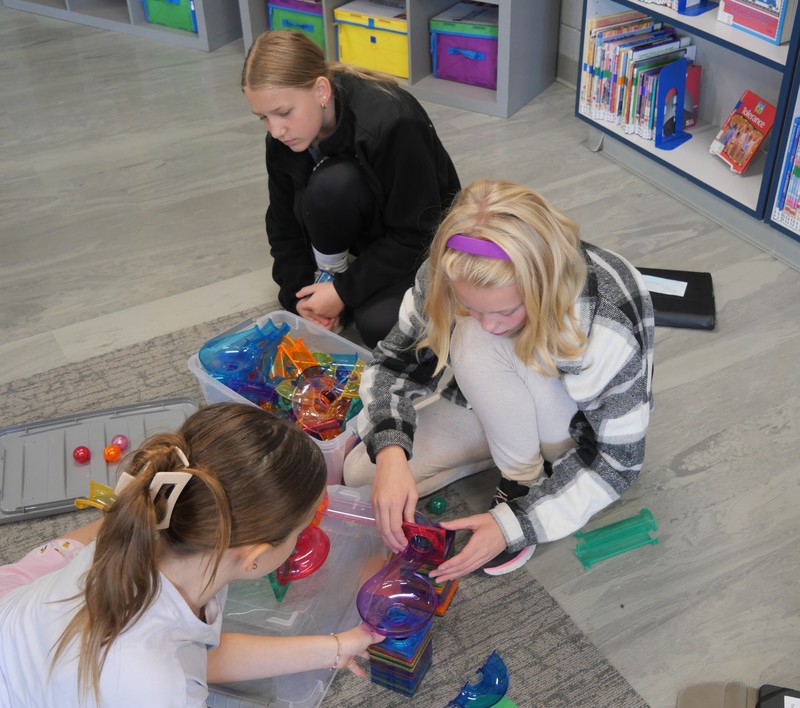 SES student working with Picasso Tiles