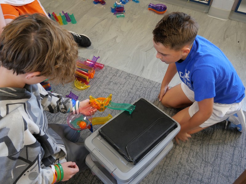 SES student working with Picasso Tiles