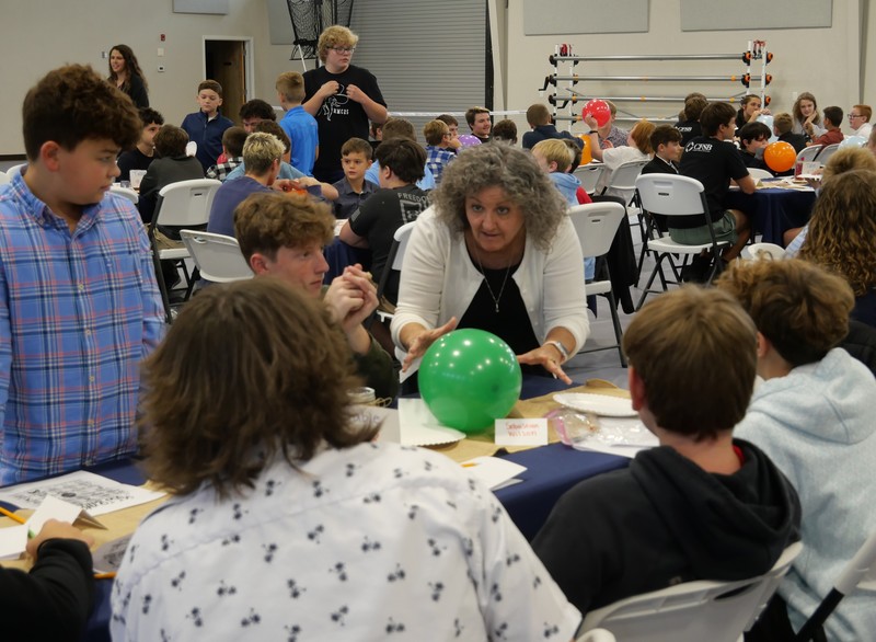 Marshall Male Conference attendees work on balloon project