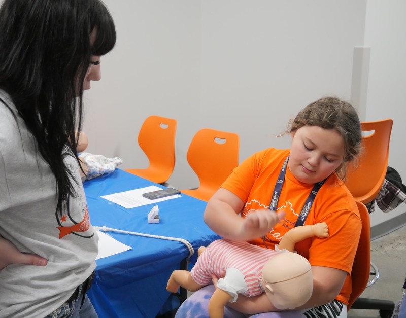 Student saves choking baby (doll)