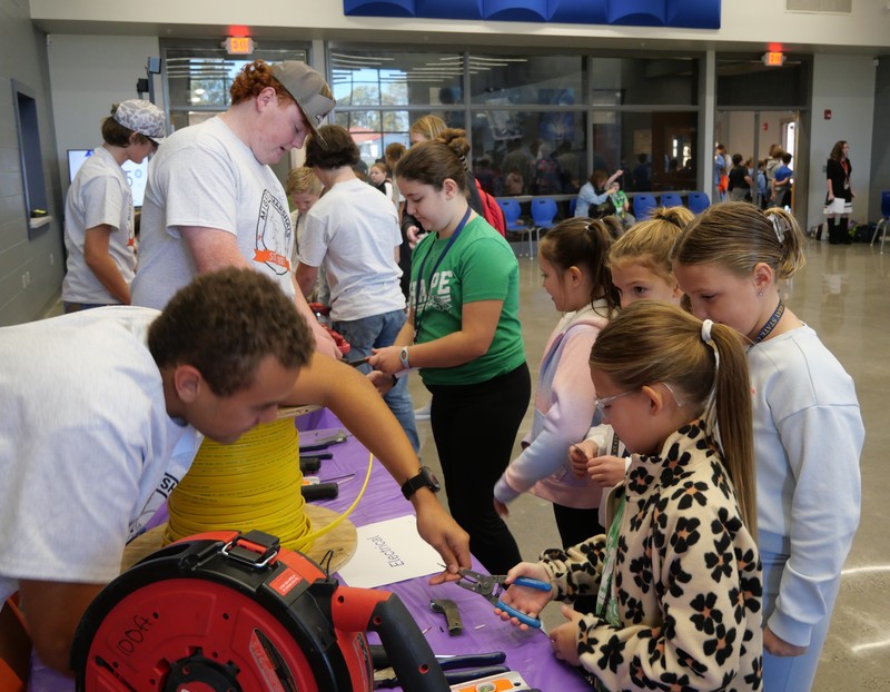 Students use drill at STEAM Quest