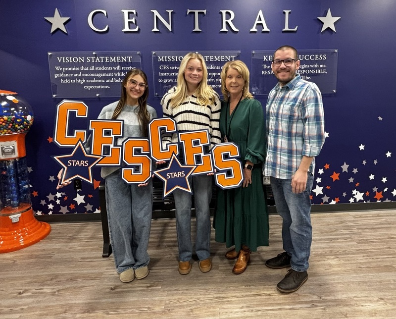 Students with custom CES signs