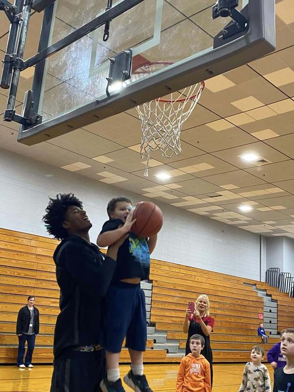 Link Academy players in BES gym with students