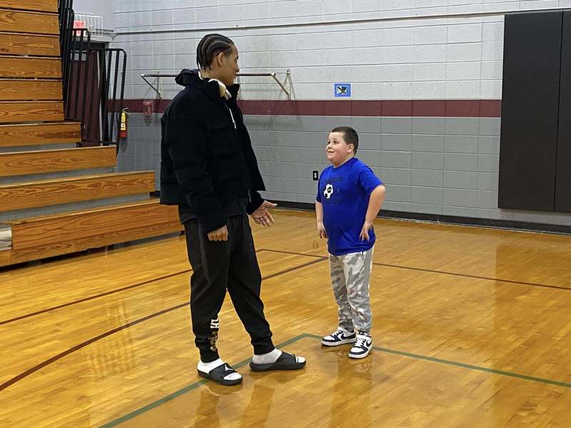 Link Academy players in BES gym with students