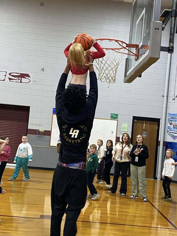 Link Academy players in BES gym with students