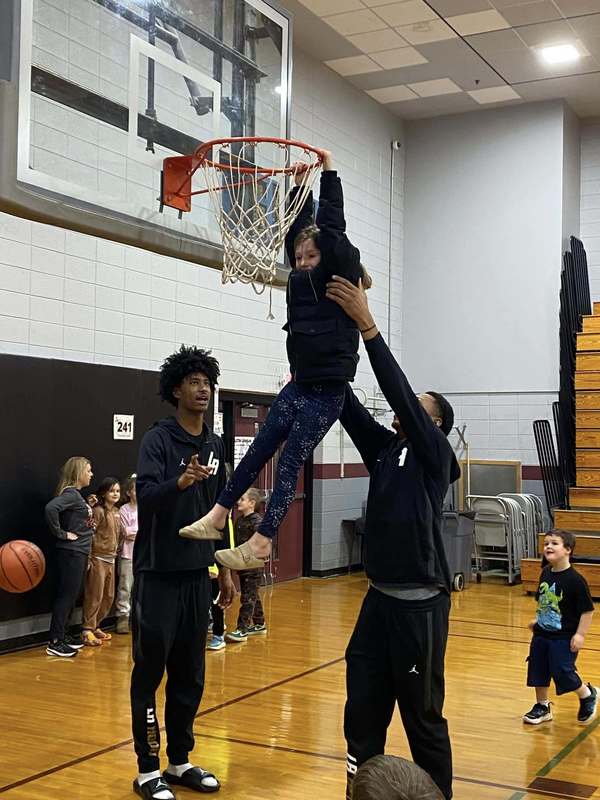 Link Academy players in BES gym with students
