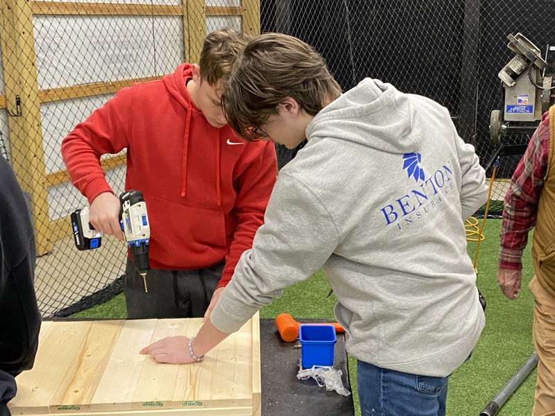 MC baseball players  building  beds 