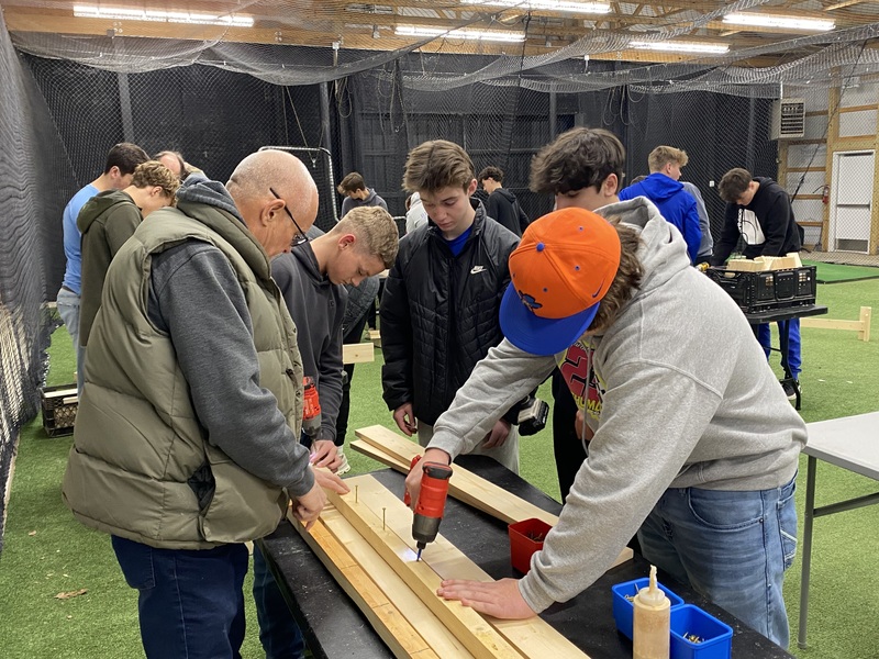 MC baseball players  building  beds 