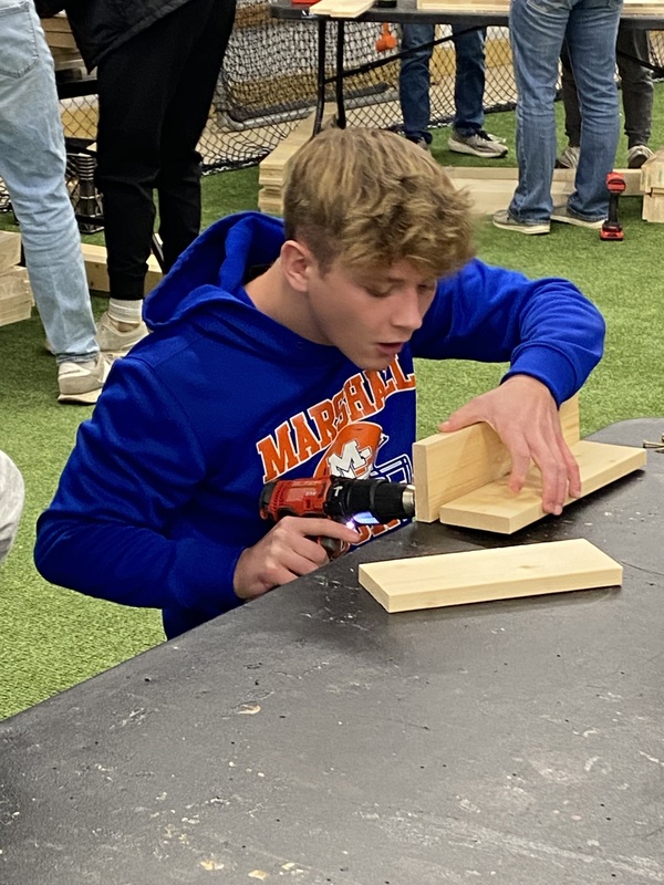 MC baseball players  building  beds 