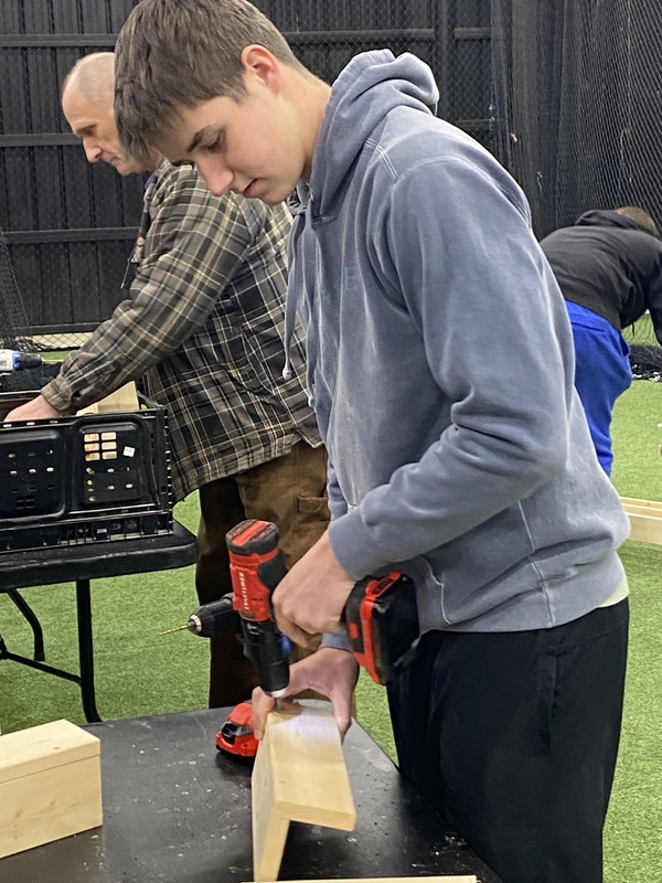 MC baseball players  building  beds 
