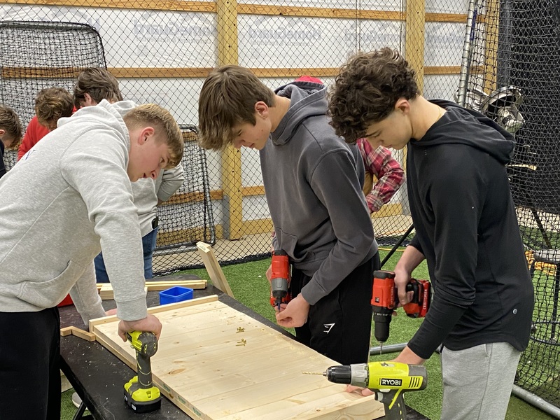MC baseball players  building  beds 