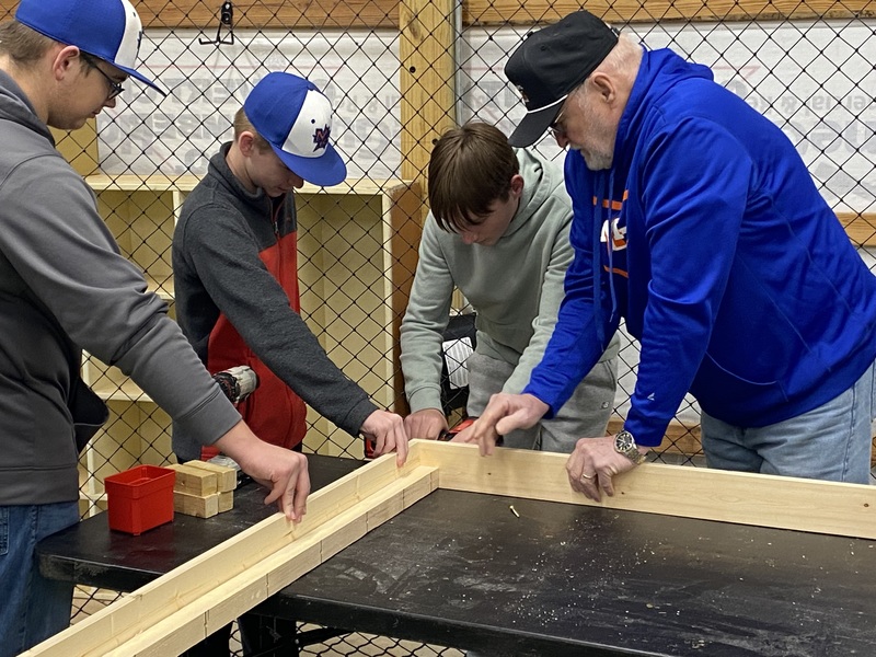 MC baseball players  building  beds 