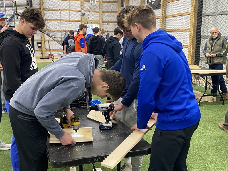 MC baseball players  building  beds 