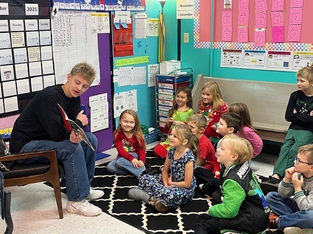 High School students reading to Elementary students