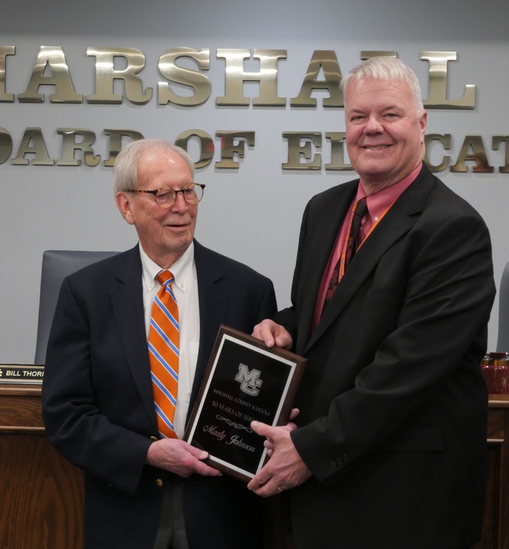 Marty Johnson get plaque from Supt. Thorpe