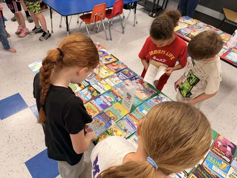 MC Students with books donated by MC Rotary