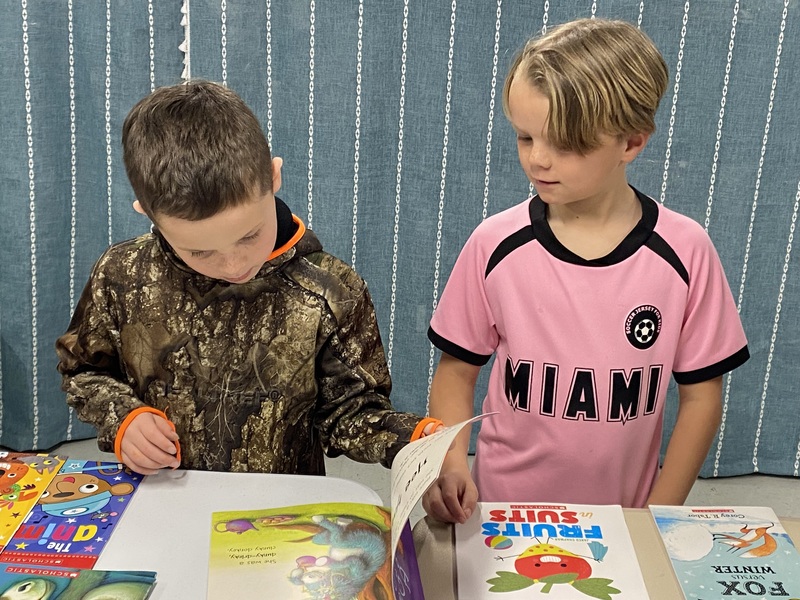 MC Students with books donated by MC Rotary