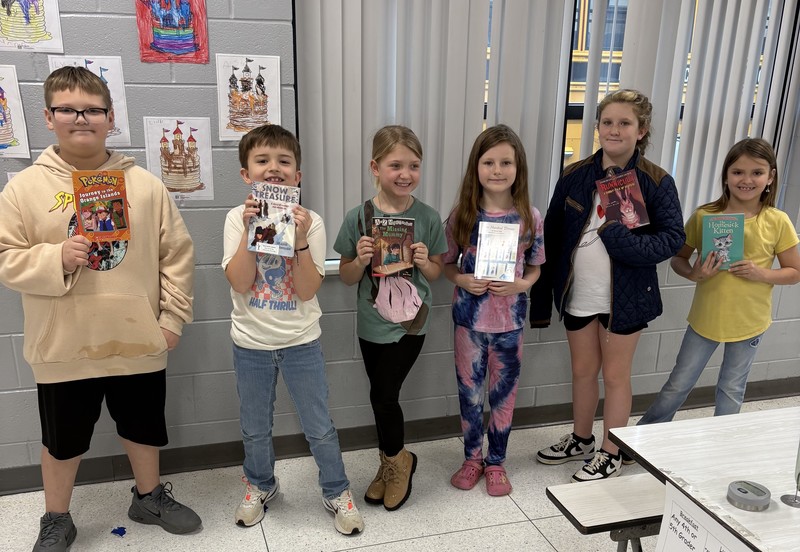 MC Students with books donated by MC Rotary