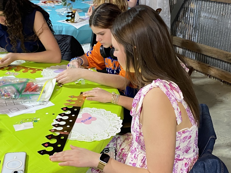 Female students working on acitivity at Leadership Forum