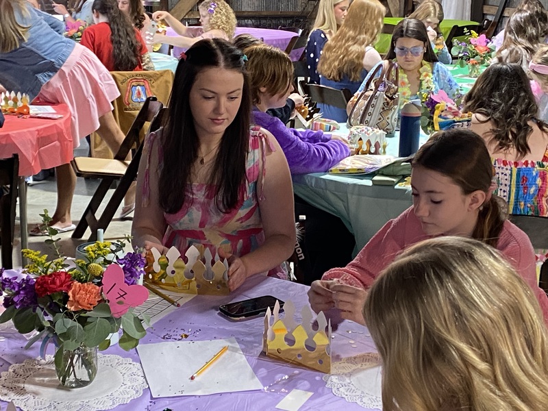 Female students working on acitivity at Leadership Forum