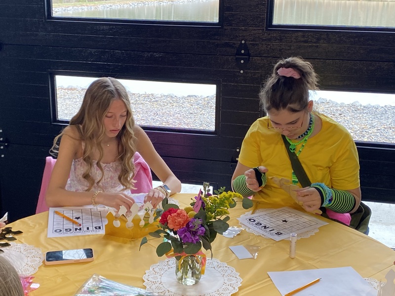 Female students working on acitivity at Leadership Forum