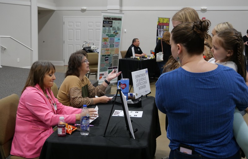 Dept. of Juvenile Justice talking to student during Truth or Consequences