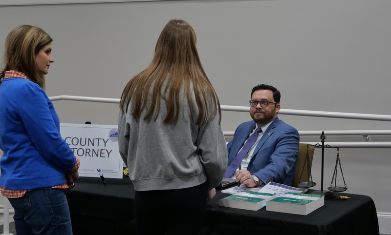 County Attorney talking to student during Truth or Consequences