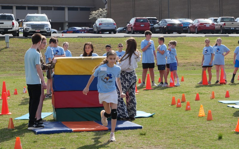 Students running obstacle course at Team Ultra Field Day