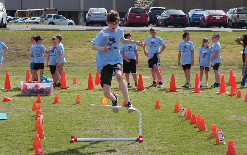 Students running obstacle course at Team Ultra Field Day
