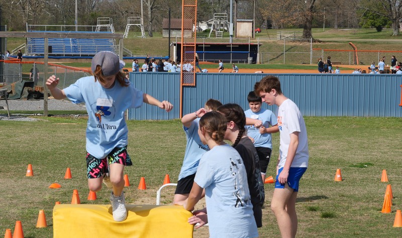 Students running obstacle course at Team Ultra Field Day