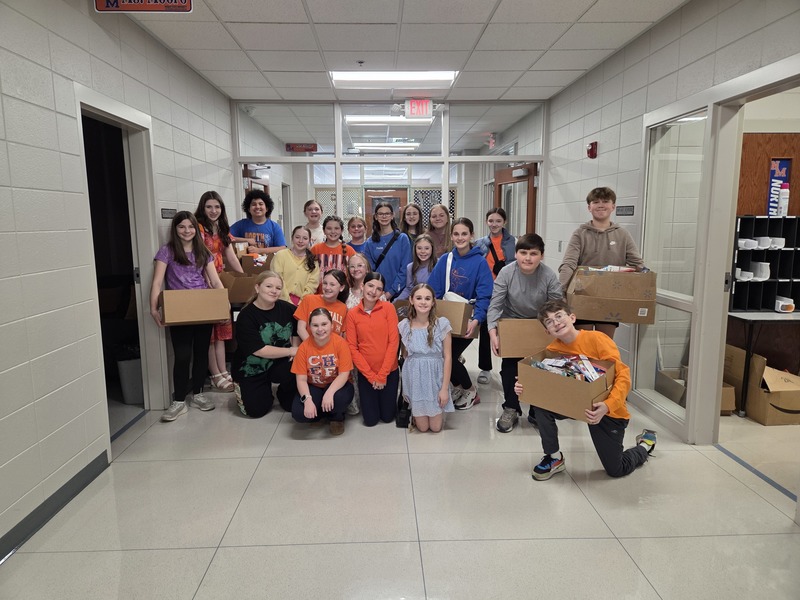 NMMS students donating backpacks