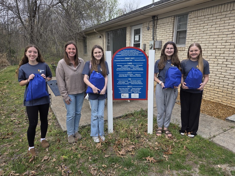 NMMS students delivering backpacks