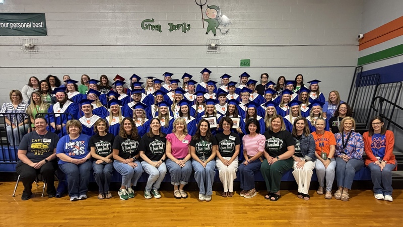 Senior group picture with SES staff in gym