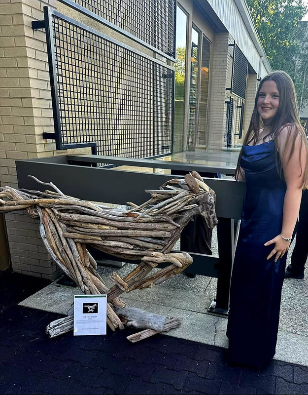 MCHS student Edie Jones with her horse sculpture "Free Roamer"