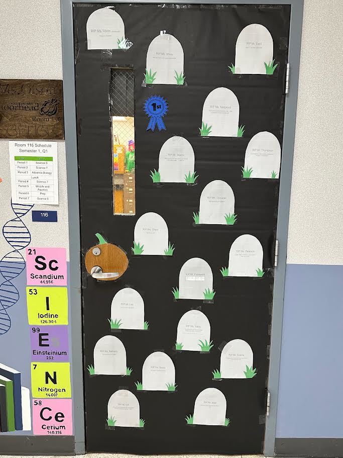 High School had a door decorating contest here are the winners of the Staff Decorated Doors: 1st place: Ms. Olson's "Teacher Graveyard", 2nd place: Mrs. Grandstrand's "The Great Pumpkin" , 3rd place: Mrs. Donarski's "rival of a Picasso" Congratulations!