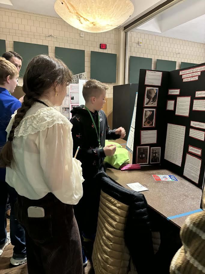 Here are a couple of pictures of our 6th graders at the Regional Science Fair today (2/20) - Congratulations and Good Luck students!
