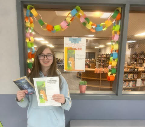 Congratulations to Aubrey Underdahl, the winner of our Middle School Bookmark Contest! The fifth and sixth grade students have had the opportunity during library to draw a bookmark inspired by a book, with the submissions being voted on by MCC staff. Aubrey's bookmark, inspired by "Warriors", came out on top! Aubrey won a free book of her choice and her winning bookmark has been printed for students to take and use. Congratulations!"