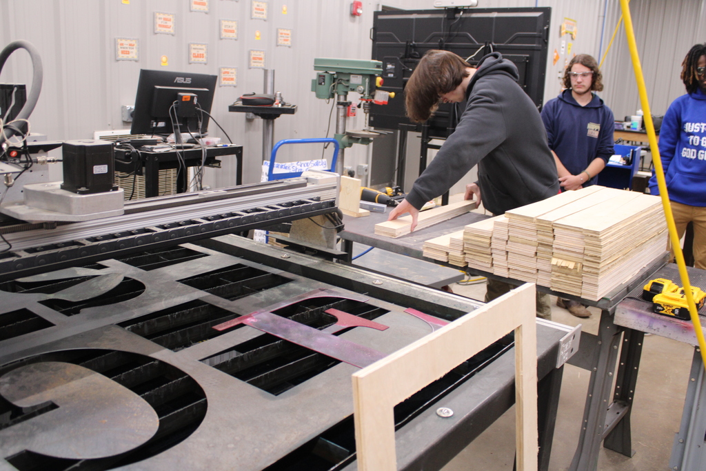 Students learning assembly line