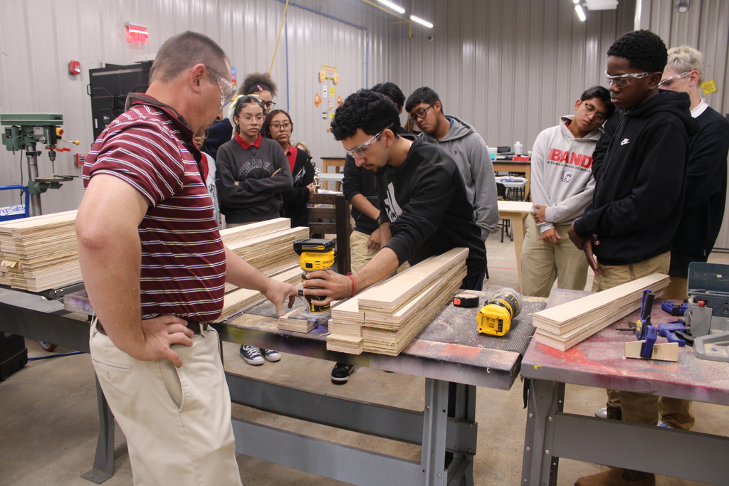 Students learning assembly line
