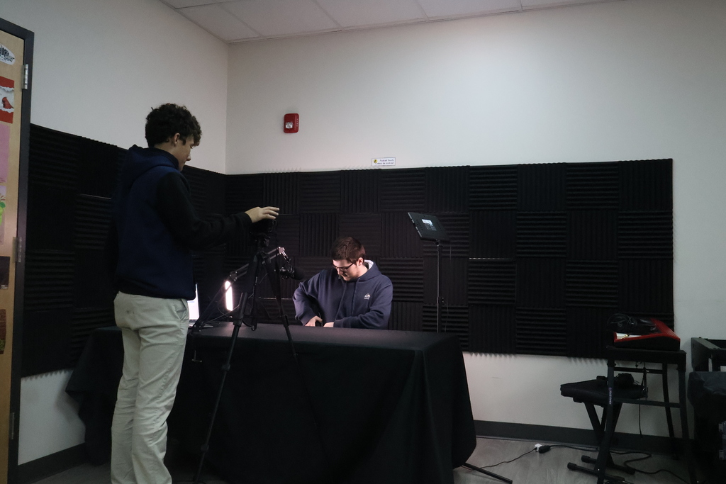 Two multimedia students preparing for a recording