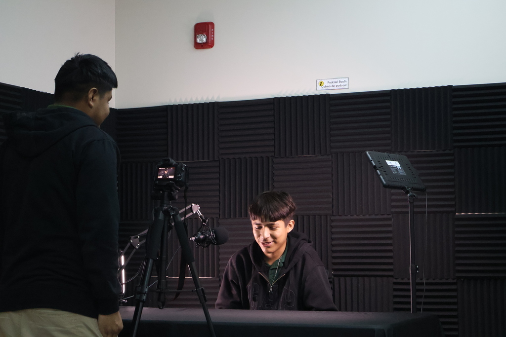 Two multimedia students recording an interview. 