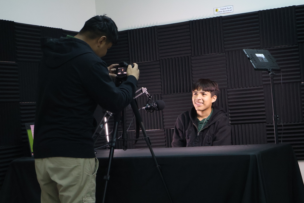 Two students recording an interview.